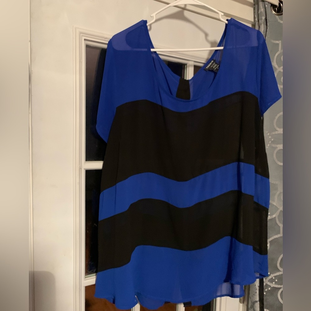 TORRID- Womens size 3X, silky blue and black blouse with button down back.
